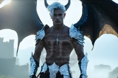 The Dragon Prince - A very attractive shirtless young male prince,standing next to him a huge dragon.
