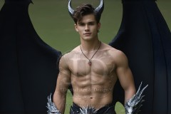 The Dragon Prince - A very attractive shirtless young male prince,standing next to him a huge dragon.