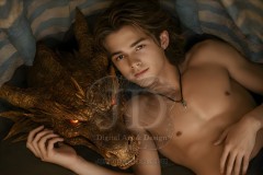 The Dragon Prince - A very attractive shirtless young male prince,standing next to him a huge dragon.