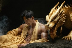The Dragon Prince - A very attractive shirtless young male prince,standing next to him a huge dragon.